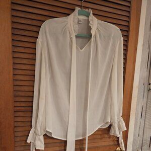 White blouse with ruffled neckline